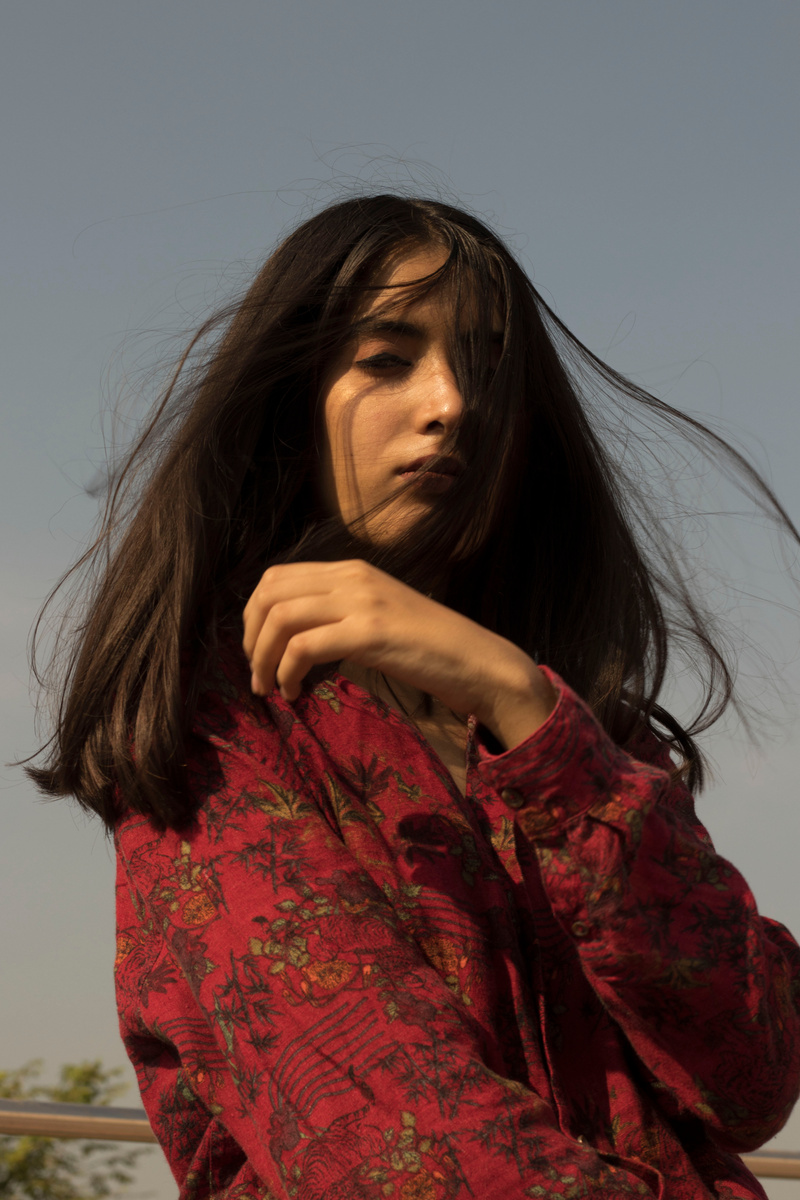 Woman Wearing Red and  Floral Top